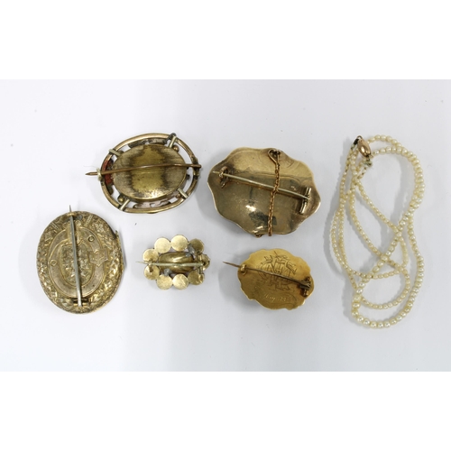 62 - Victorian yellow metal brooches to include two seed pearl brooches, coral brooch and another with dr... 