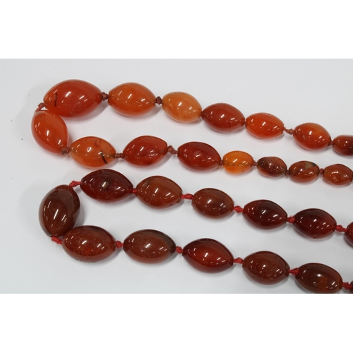 63 - Three strands of vintage coloured glass and hardstone beads, (3)