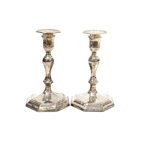 67 - A pair of George VI silver candlesticks, on octagonal weighted bases, Sheffield 1941, 17cm high (2)