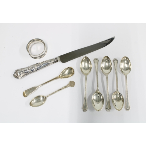 75 - Seven silver teaspoons with various hallmarks, a Birmingham silver napkin ring and a silver handled ... 