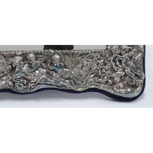 76 - An Art Nouveau style Britannia standard silver mirror, London 1998, rectangular form with embossed c... 