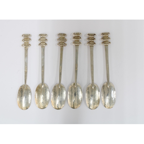 8 - A rare set of six silver teaspoons by Bertha Inglis, Edinburgh 1951, with planished bowls and flower... 