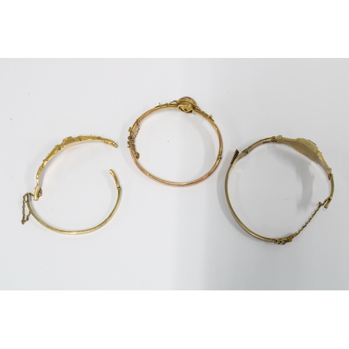 83 - Two Victorian unmarked yellow metal bracelets together with another damaged bangle (3)