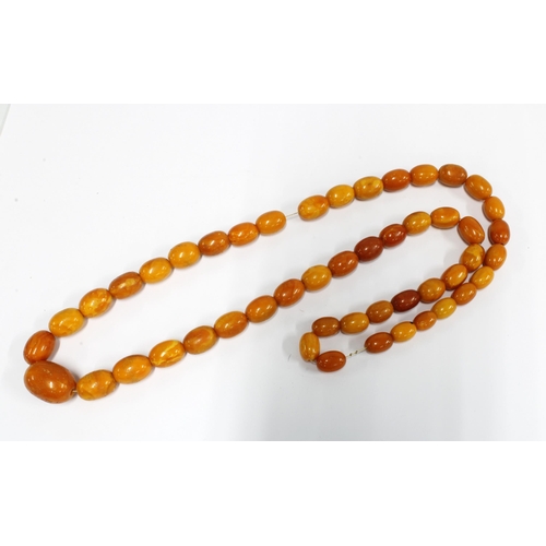 88 - A strand of vintage butterscotch amber beads, (approx 79g)