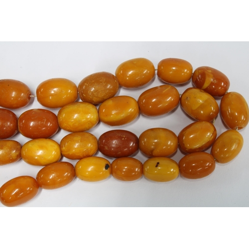 88 - A strand of vintage butterscotch amber beads, (approx 79g)