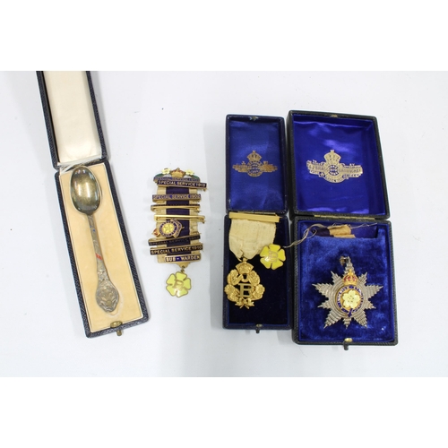 395 - A group of Edwardian Primrose League medallions and lapel pins together with a cased souvenir spoon