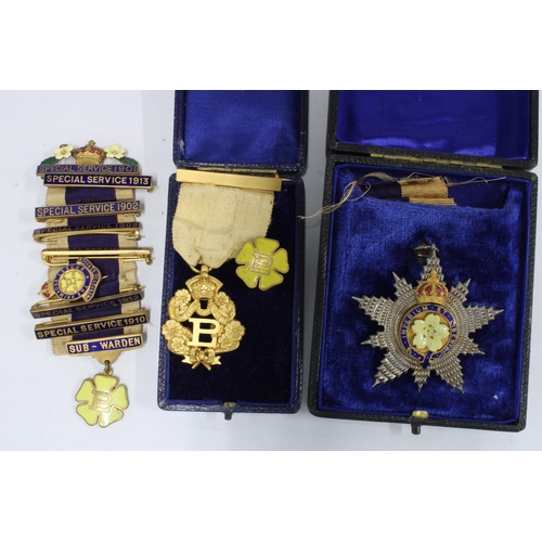 395 - A group of Edwardian Primrose League medallions and lapel pins together with a cased souvenir spoon