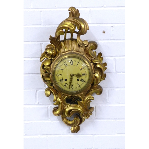 415 - Gilt Cartel wall clock by Exacta of Sweden, 32 x 60cm.