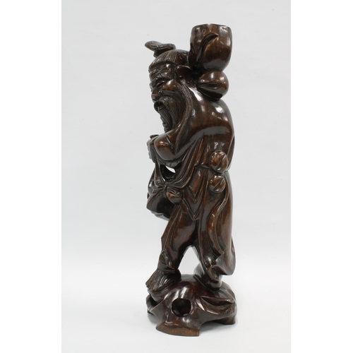 419 - A Chinese carved wood figure of a Sage, 42.5cm high