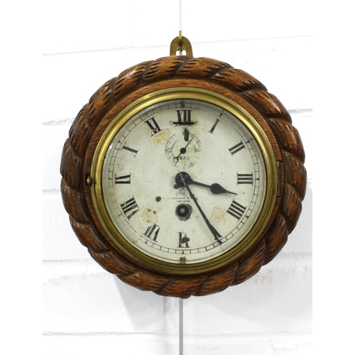 434 - Early 20th century Dent wall clock, in a circular rope twist case, 23cm