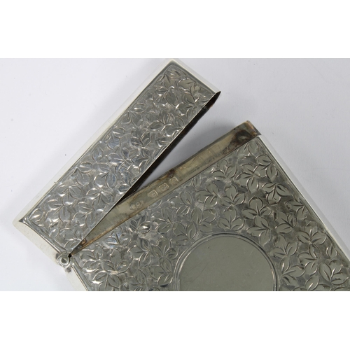 61 - An Edwardian silver card case, Smith & Bartlam, Birmingham 1908, with an allover pattern of leaves w... 