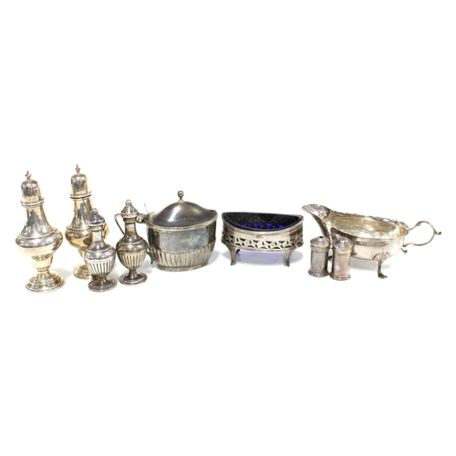 71 - Silver condiments to include pepper pots, salt and mustard, together with a silver sauce boat jug, w... 