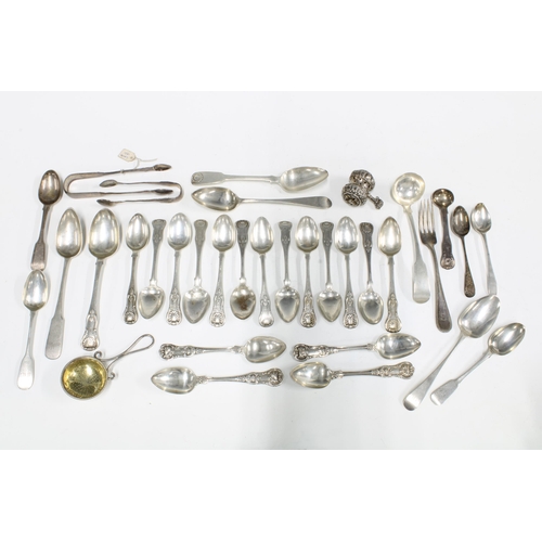 74 - A collection of silver teaspoons, sugar tongs, forks, etc, with various silver hallmarks and makers ... 