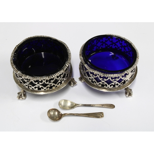 80A - A pair of Victorian silver salts, of large circular form with wavy rim and pierced design, raised n ... 