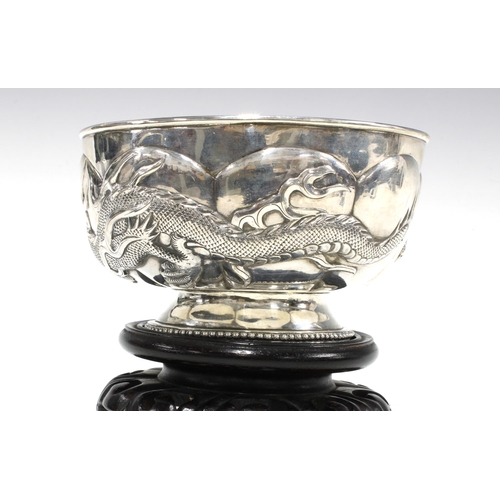 81 - WANG HING Chinese Export silver 'Dragon' bowl on a stylised hardwood stand, base signed with initial... 