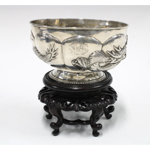 81 - WANG HING Chinese Export silver 'Dragon' bowl on a stylised hardwood stand, base signed with initial... 