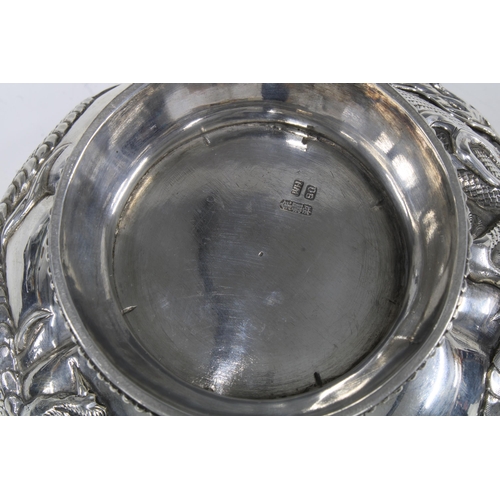 81 - WANG HING Chinese Export silver 'Dragon' bowl on a stylised hardwood stand, base signed with initial... 