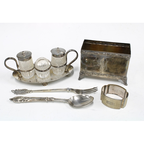 82 - An Edwardian silver stand with three glass and silver mounted condiments Sheffield 1904 together wit... 