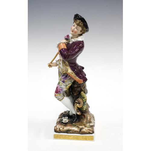 107 - 19th century Volkstedt porcelain figure of a Gallant Gent, wearing a puce jacket and floral breeches... 