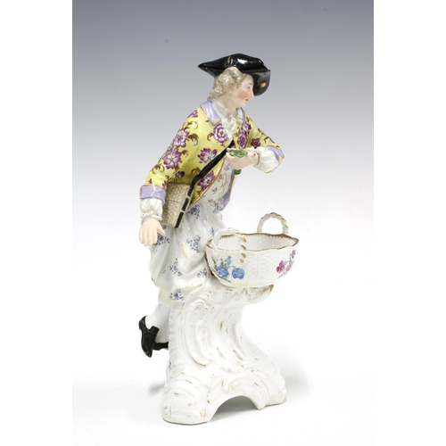 108 - Berlin figural porcelain salt, modelled as a Gallant Gent holding an open basket , blue sceptre back... 