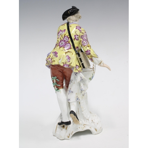 108 - Berlin figural porcelain salt, modelled as a Gallant Gent holding an open basket , blue sceptre back... 