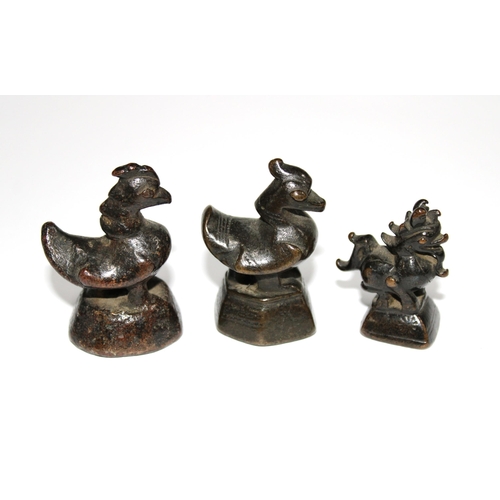 147 - Three bronze opium weights (3)