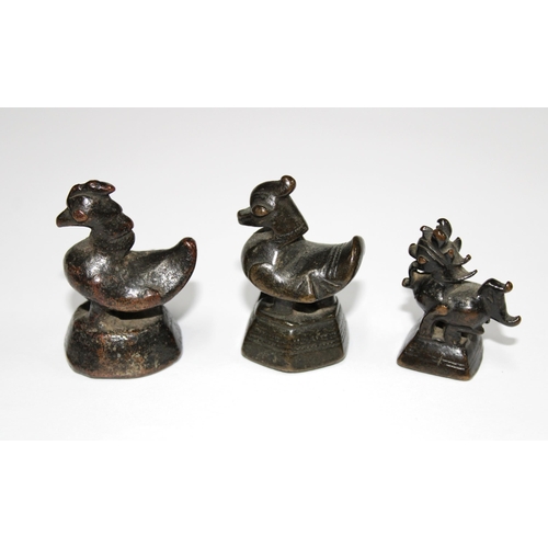 147 - Three bronze opium weights (3)