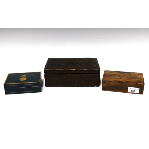 150 - An Eastern carved wood box, a sandalwood box and a blue stained wood box with insignia to the hinged... 