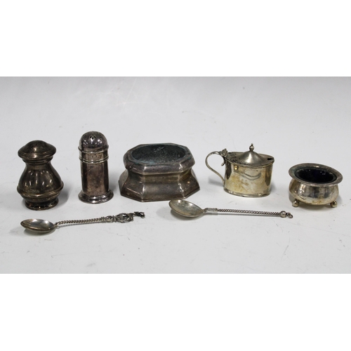 18 - A collection of silver condiments to include pepper pots, salts and mustard, and two continental sil... 