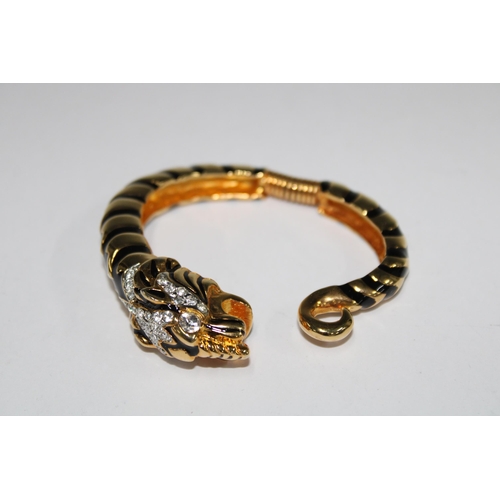 20 - KENNETH J. LANE, Tiger gilt metal and paste clamper bracelet, signed
