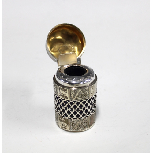 29 - Edwardian silver gilt scent bottle / smelling salts jar, with hinged cover and pierced and a blue gl... 