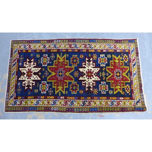 319 - Eastern wool rug, Kazak design with four star motifs, 194 x 108cm