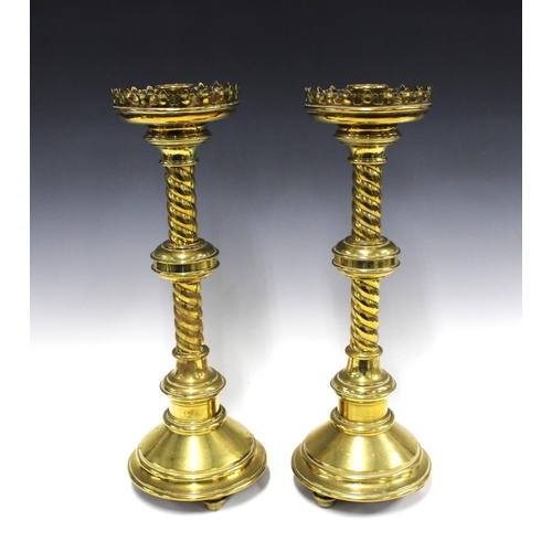 327 - A large pair of Gothic Ecclesiastical brass candlesticks for John Hardman & Co. 50cm high (2)