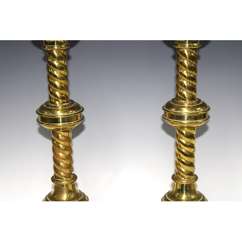 327 - A large pair of Gothic Ecclesiastical brass candlesticks for John Hardman & Co. 50cm high (2)