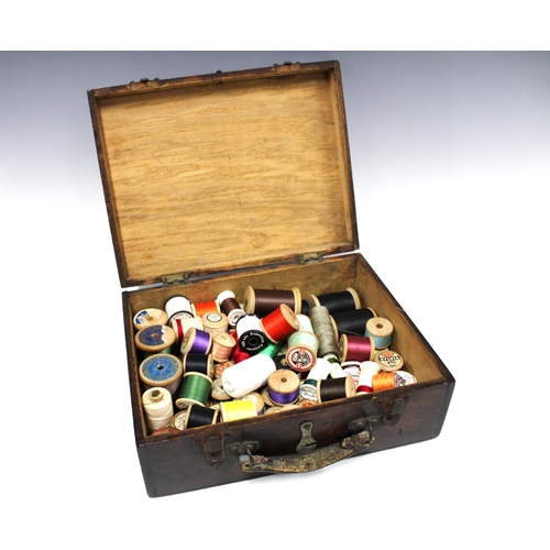 348 - Early 20th century stained pine box containing a quantity of vintage cotton reel threads