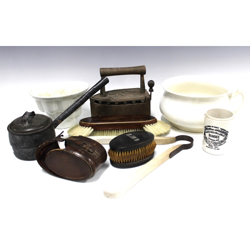 390 - 19th century and later kitchenalia to include a jelly mould, iron pan and flat iron, together with a... 