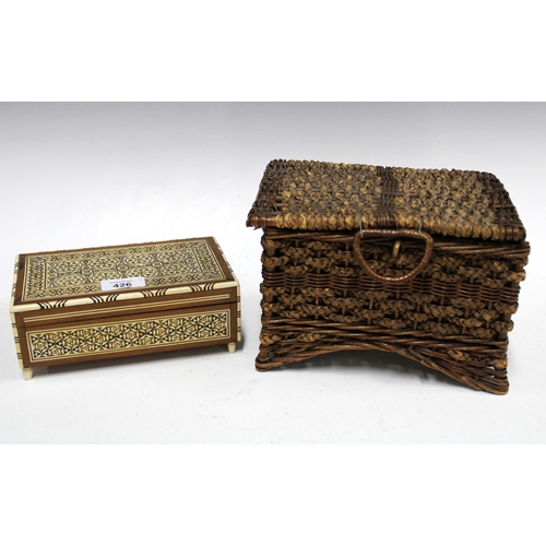 426 - Wicker sewing basket containing vintage cotton threads together with an Eastern inlaid musical box (... 