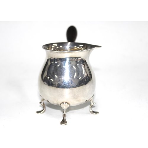 55 - Walker & Hall silver brandy pan, Sheffield 1909, with ebonised handle and four hoof feet, 19cm