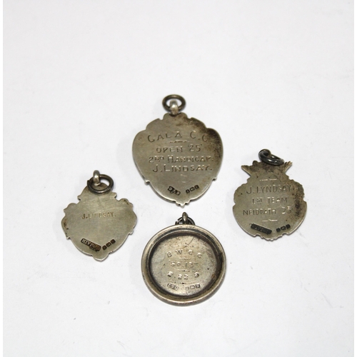 62 - Four early 20th century silver fob medals, presented to J. Lindsay, one for cycling (4)