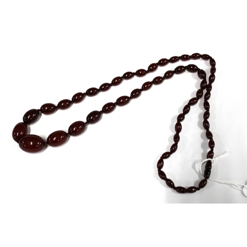 73 - A graduated strand of vintage cherry amber beads, largest bead approx 2.8cm, approx 61.6g