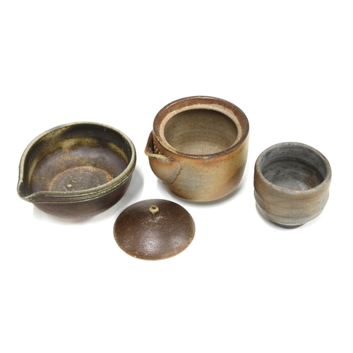 84 - Collection of studio pottery to include a small pot with cover  and spout, another without a lid and... 