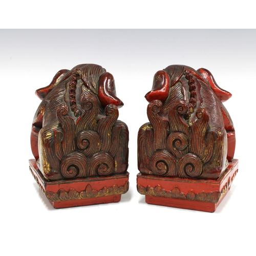 88 - A pair of Chinese painted giltwood Temple Dogs of Fo (2) 12 x 17cm.