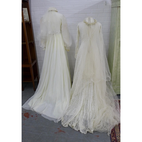 320 - Two vintage wedding dresses, together with a veiled lace cap and a floral headband veil (4)