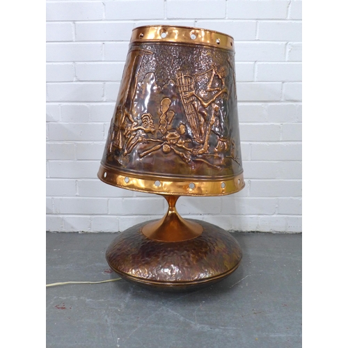 322 - Large copper table lamp and shade, embossed with African figures, 74cm