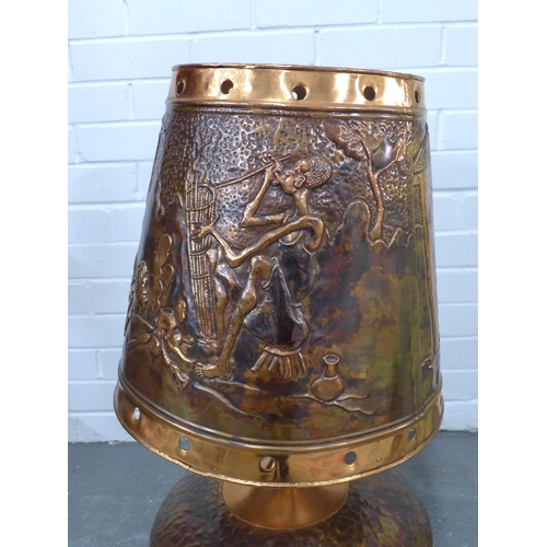 322 - Large copper table lamp and shade, embossed with African figures, 74cm