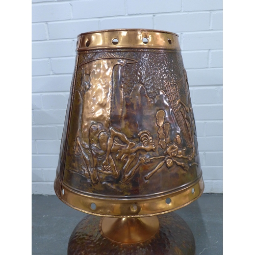 322 - Large copper table lamp and shade, embossed with African figures, 74cm