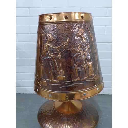 322 - Large copper table lamp and shade, embossed with African figures, 74cm