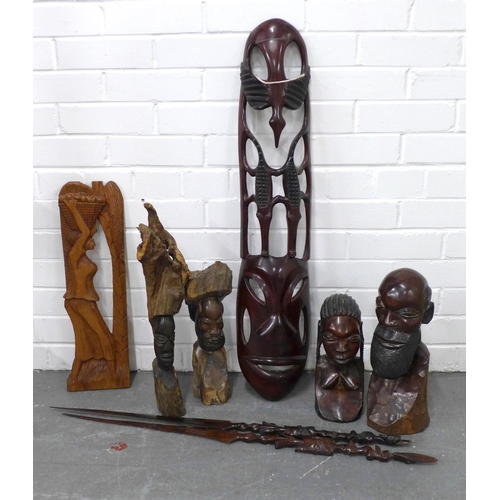 323 - A collection of carved wooden African items to include figures, spears and pierced shield, etc  (8)