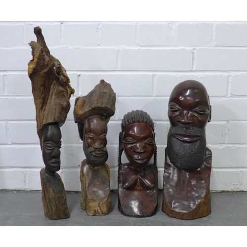 323 - A collection of carved wooden African items to include figures, spears and pierced shield, etc  (8)