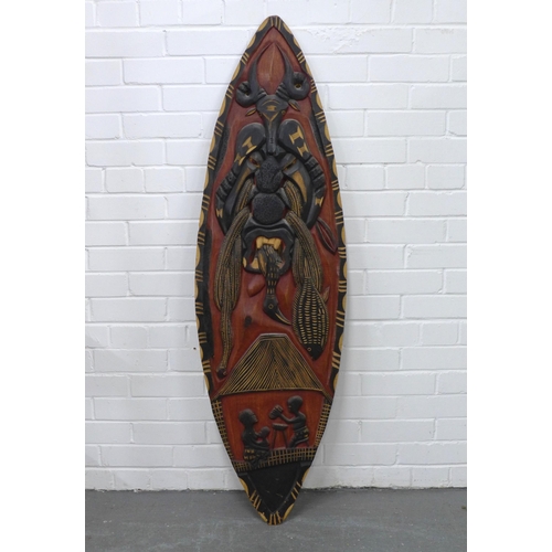 324 - Carved & painted African shield, 139cm